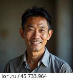 A man residing in Thailand shows a friendly smile while posing for a portrait. Natural light highlights his features, creating an inviting atmosphere. Generative AI. Стоковое AI-изображение, AI-художник Юлия Петровская / Фотобанк Лори