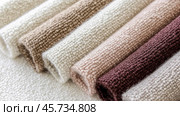 Boucle Fabric samples in various neutral colors close up arranged, texture detail, interior design palette background. Стоковое AI-изображение, AI-художник Анастасия Золотницкая / Фотобанк Лори