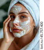 Spa treatments for the face, peeling face mask, skin care. Young woman with cream mask on her face. Close-up. Стоковое AI-изображение, AI-художник Сергей Елизарьев / Фотобанк Лори