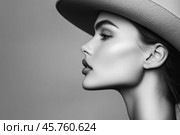 Девушка в шляпе в чёрно белых тонах. Стоковое AI-изображение, AI-художник Александр Жуков / Фотобанк Лори