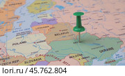 Ukraine - Travel concept with green pushpin on the world map. The location point on the map points to Kiev the capital of the Ukraine. (2022 год). Стоковое видео, видеограф Андрей Армягов / Фотобанк Лори