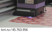 Modern Digital Large format UV printer. Printing production technologies. UV pinning is the process of applying a dose of low intensity ultraviolet light to a UV curable ink. Стоковое видео, видеограф Андрей Армягов / Фотобанк Лори