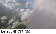 A sky filled with fluffy white cumulus clouds over a natural landscape. Стоковое видео, видеограф Степанов Григорий / Фотобанк Лори