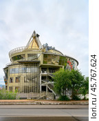 ULAN-UDE,  RUSSIA - AUGUST 12, 2024. A modern building in the shape of the national headdress of the Buryats. Редакционное фото, фотограф Сергей Фролов / Фотобанк Лори