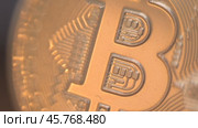 Gold Bitcoin Symbol beautifully placed on a Wooden Surface. Close up. Стоковое видео, видеограф Степанов Григорий / Фотобанк Лори