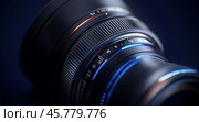 Close-up view of a professional camera lens showcasing detailed elements and textures under soft lighting. Стоковое AI-изображение, AI-художник Юлия Гапеенко / Фотобанк Лори