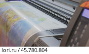 Modern Digital Large format UV printer. Printing production technologies. UV pinning is the process of applying a dose of low intensity ultraviolet light to a UV curable ink. Стоковое видео, видеограф Андрей Армягов / Фотобанк Лори