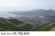 Panoramic view of Novorossiysk City and Tsemess Bay at sunrise. Morning cityscape of large port at Black Sea coast in Russia. Стоковое фото, фотограф Фотограф / Фотобанк Лори