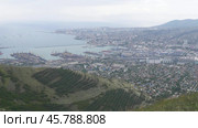 Panoramic view of Novorossiysk City and Tsemess Bay at sunrise. Morning cityscape of large port at Black Sea coast in Russia. Стоковое фото, фотограф Фотограф / Фотобанк Лори