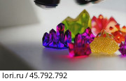 Colorful crystals shining under bright light. Стоковое видео, видеограф Данил Руденко / Фотобанк Лори