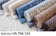 Boucle Fabric samples in various neutral colors close up arranged, texture detail, interior design palette background. Стоковое AI-изображение, AI-художник Анастасия Золотницкая / Фотобанк Лори