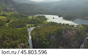 Latefossen is one of the most visited waterfalls in Norway and is located near Skare and Odda in the region Hordaland, Norway. Consists of two separate streams flowing down from the lake Lotevatnet. (2019 год). Стоковое видео, видеограф Андрей Армягов / Фотобанк Лори