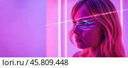 Side view of young woman with pink laser light on face, modern beauty concept, glowing skin, futuristic background, neon aesthetic, skincare. Стоковое AI-изображение, AI-художник Павел Муравьев / Фотобанк Лори