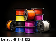 Many colorful spools of plastic filament arranged and stacked together, ready for 3d printing. Стоковое AI-изображение, AI-художник Иван Рябоконь / Фотобанк Лори