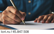 Detailed closeup of businessman hands writing with pen on a sheet of document. Business person Signing Contract In The Office on a Desk Table. Man in suit penning an agreement on paper. Productivity. Стоковое AI-видео, аниматор Марина Демидюк / Фотобанк Лори
