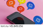 Chat Bubbles Set Above a Mobile Phone Against a Vibrant Pink Background. Mobile Communication Concept. Smartphone with Colorful Chat Bubbles digital interaction and connectivity. Social network. Стоковое AI-видео, аниматор Марина Демидюк / Фотобанк Лори