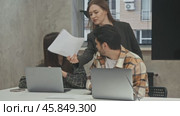 Tired office workers are unhappy about the extra workload they are receiving. Стоковое видео, видеограф Strunov David / Фотобанк Лори
