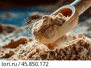 Wooden scoop pouring maca powder into a pile. Стоковое AI-изображение, AI-художник Иван Рябоконь / Фотобанк Лори