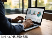 Businessman analyzing financial charts and graphs on laptop in office. Стоковое AI-изображение, AI-художник Иван Рябоконь / Фотобанк Лори