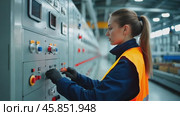 Technician Operates Control Panel in Industrial Facility While Wearing Safety Gear. Стоковое AI-видео, аниматор Sergey Grishin / Фотобанк Лори