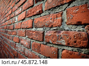 Close up of red brick wall showing deteriorating mortar. Стоковое AI-изображение, AI-художник Иван Рябоконь / Фотобанк Лори