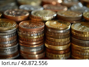 Stacks of coins representing savings, investment, and financial growth. Стоковое AI-изображение, AI-художник Иван Рябоконь / Фотобанк Лори