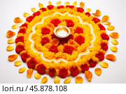Flower rangoli decoration for diwali festival with burning diya. Стоковое AI-изображение, AI-художник Иван Рябоконь / Фотобанк Лори