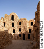 Uninhabited fortified village with houses and granaries, Tunisia. Ksar of Mgabla, Berber, Tataouine. Стоковое фото, фотограф Яков Филимонов / Фотобанк Лори