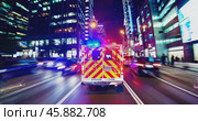 rear view of ambulance with flashing lights driving fast through night city. Стоковое AI-видео, аниматор Александр Довянский / Фотобанк Лори