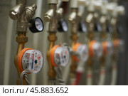 Приборы учета потребления коммунальных ресурсов многоквартирного дома. Metering devices for the consumption of communal resources in an apartment building. Стоковое фото, фотограф Юрий Карачев / Фотобанк Лори