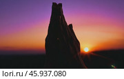 Woman praying with hands folded at sunset. Стоковое видео, видеограф Данил Руденко / Фотобанк Лори