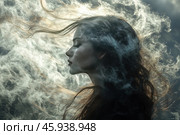 A female profile surrounded by thick clouds of smoke or fog. The girl's face is subtly illuminated, highlighting her features: a thin nose, expressive lips and a soft curve of the chin. Her hair is disheveled and flutters in different directions, as if affected by the wind. The fog or smoke creates a mystical and ephemeral atmosphere, enveloping the figure, as if the girl is in a state of merging with the natural elements. Light and shadow play on her face and hair, adding depth and drama. The background is darkened, which enhances the contrast and makes the figure the central element of the composition. Стоковое AI-изображение, AI-художник Анна Кривицкая / Фотобанк Лори