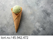 Sweet dessert. Ice cream cones with different flavors on a concrete gray background. World Ice Cream Day. Стоковое AI-изображение, AI-художник Photojuli / Фотобанк Лори