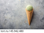 Sweet dessert. Ice cream cones with different flavors on a concrete gray background. World Ice Cream Day. Стоковое AI-изображение, AI-художник Photojuli / Фотобанк Лори