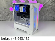 Modern white computer system unit   with rgb fans and colorful bright rgb rainbow led lighting. Стоковое фото, фотограф Регина Ерофеева / Фотобанк Лори