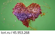 Colorful powder particles exploding forming a heart shape against a green screen background. Glitter dust creating vibrant dynamic visual heart-shaped form. Sparkle grains.14 February Valentine's Day. Стоковое AI-видео, аниматор Марина Демидюк / Фотобанк Лори