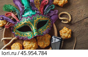 Celebrate Purim With Hamantaschen Cookies, Colorful Masks, and Festive Noisemakers for a Joyful Holiday Experience. Стоковое AI-видео, аниматор Sergey Grishin / Фотобанк Лори