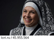 Portrait of a smiling nun wearing a costume, isolated on transparent background. Стоковое AI-изображение, AI-художник Александр Поташев / Фотобанк Лори
