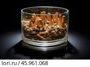 Cigarette butts filling glass ashtray on black background. Стоковое AI-изображение, AI-художник Иван Рябоконь / Фотобанк Лори