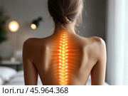 A woman with her back to the camera, with emphasis on her spine. Her fair skin highlights the striking visual effect: the spine is highlighted in a glowing orange color, creating a feeling of warmth and energy. The structure of the spine is represented anatomically accurately, including the vertebrae and the nerve endings extending from them. This effect symbolizes health, vitality, or an emphasis on the importance of the spine for the body.The woman's hair is pulled back into a neat low bun, emphasizing elegance and simplicity. The background is blurred, creating a cozy and calm atmosphere. The soft outlines of the room with warm lamps are visible, making the image comfortable and harmonious. Стоковое AI-изображение, AI-художник Анна Кривицкая / Фотобанк Лори