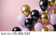 Colorful balloons create festive atmosphere for celebrations and events in vibrant shades. Стоковое AI-изображение, AI-художник Элеонора Петрова / Фотобанк Лори
