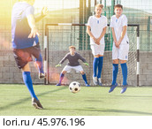 Youth football player kicking ball. Стоковое фото, фотограф Яков Филимонов / Фотобанк Лори