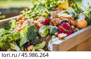 Organic waste, including leaves and grass clippings, is added into a compost pit, promoting eco-friendly recycling and composting of biodegradable materials. Стоковое AI-видео, аниматор ALLA YURTAYEVA / Фотобанк Лори