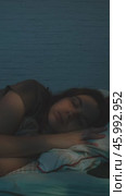 Vertical video. Insomnia. Woman sleeps restlessly at night. Стоковое видео, видеограф Маргарита Кирьякова / Фотобанк Лори