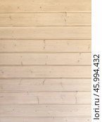 Simple wooden wall vertical background with horizontal planks showcasing natural texture in a bright interior setting. Стоковое фото, фотограф Александра Селина / Фотобанк Лори