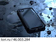 Waterproof smartphone case resisting water damage on wet surface. Стоковое AI-изображение, AI-художник Иван Рябоконь / Фотобанк Лори