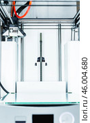 3d printer with bright red filament. Стоковое фото, фотограф Сергей Толмачёв / Фотобанк Лори