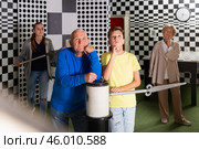 Portrait of confused boy and an elderly grandfather spending time with his family in quest room. Стоковое фото, фотограф Яков Филимонов / Фотобанк Лори