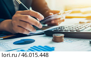 A financial analyst studies tax information and marketing strategies with a focus on audit processes, regulatory compliance, risk management, and company growth analysis. Стоковое AI-изображение, AI-художник Ирина Ручушкина / Фотобанк Лори