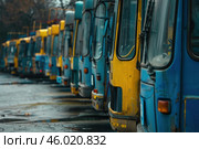 Old buses parked in a row are slowly deteriorating. Стоковое AI-изображение, AI-художник Иван Рябоконь / Фотобанк Лори